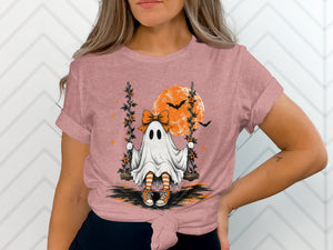 Ghost on swing with orange moon, bats, and stars, wearing striped socks.