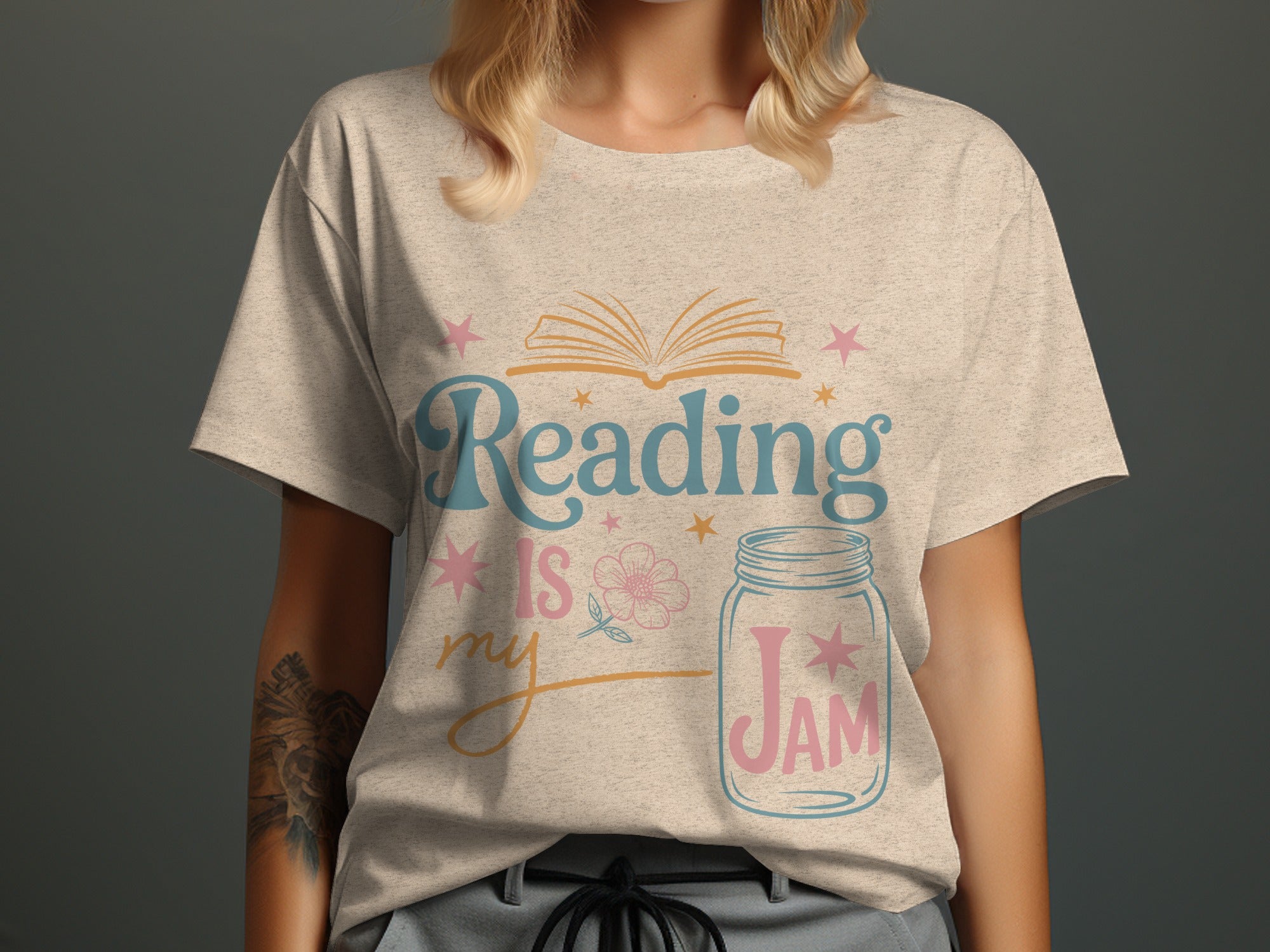 T-shirt with text "Reading IS my JAM" and a graphic of an open book and a mason jar.