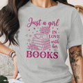 Grey t-shirt with "Just a girl in love with her books" text design.