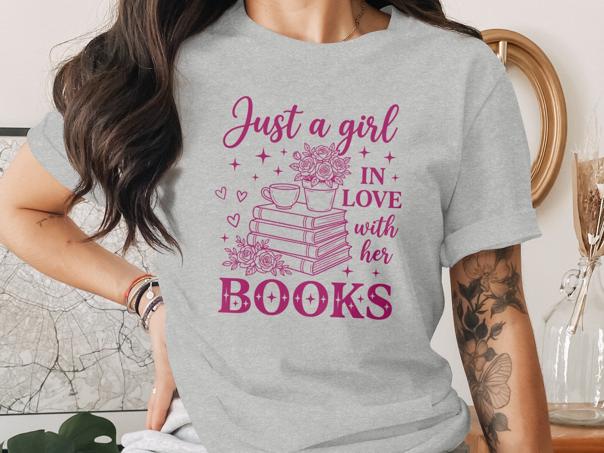 Grey t-shirt with "Just a girl in love with her books" text design.