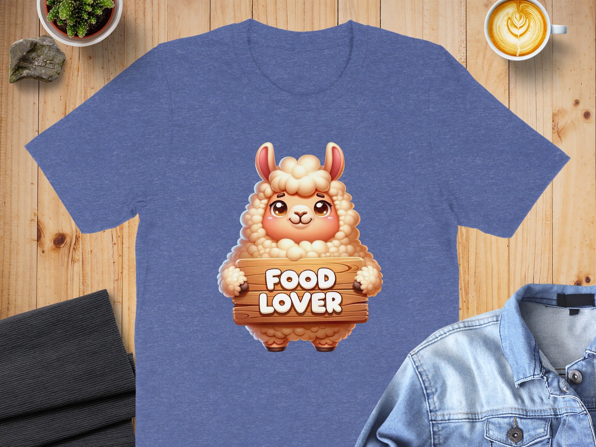 Blue t-shirt featuring a fluffy sheep holding a wooden sign that says "FOOD LOVER".