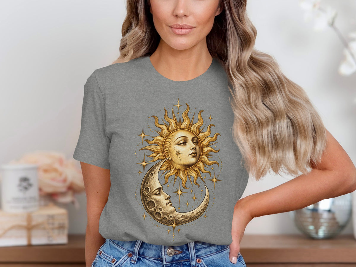 Grey t-shirt with sun and moon celestial graphic featuring faces and stars.