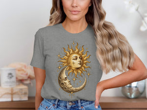 Grey t-shirt with sun and moon celestial graphic featuring faces and stars.