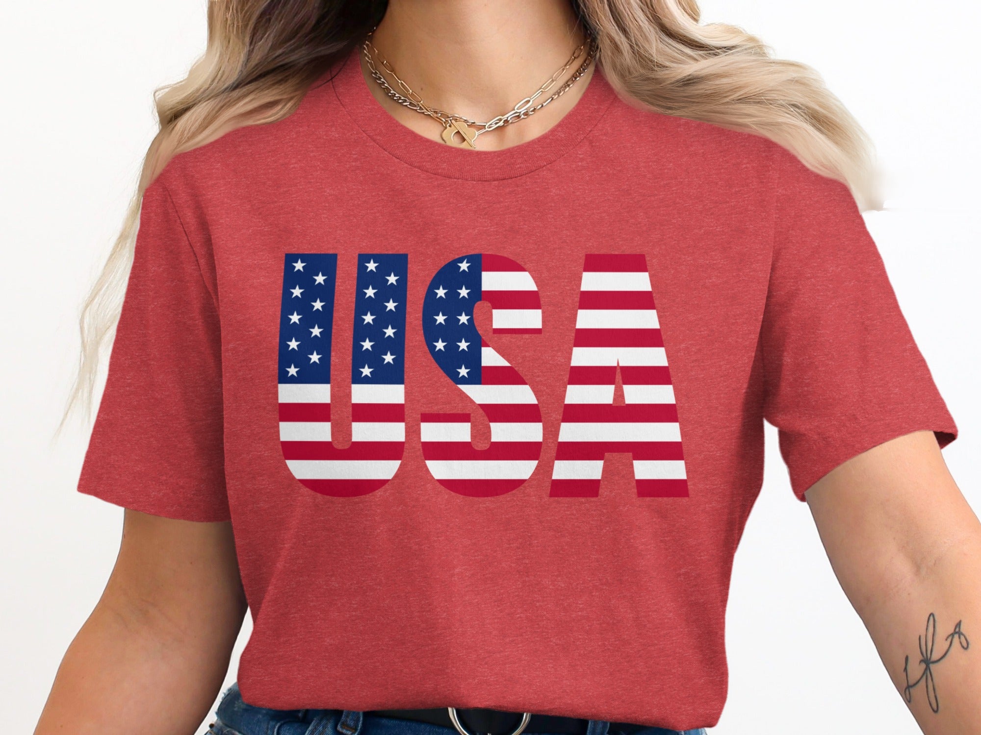 Red t-shirt with "USA" text in the American flag design.