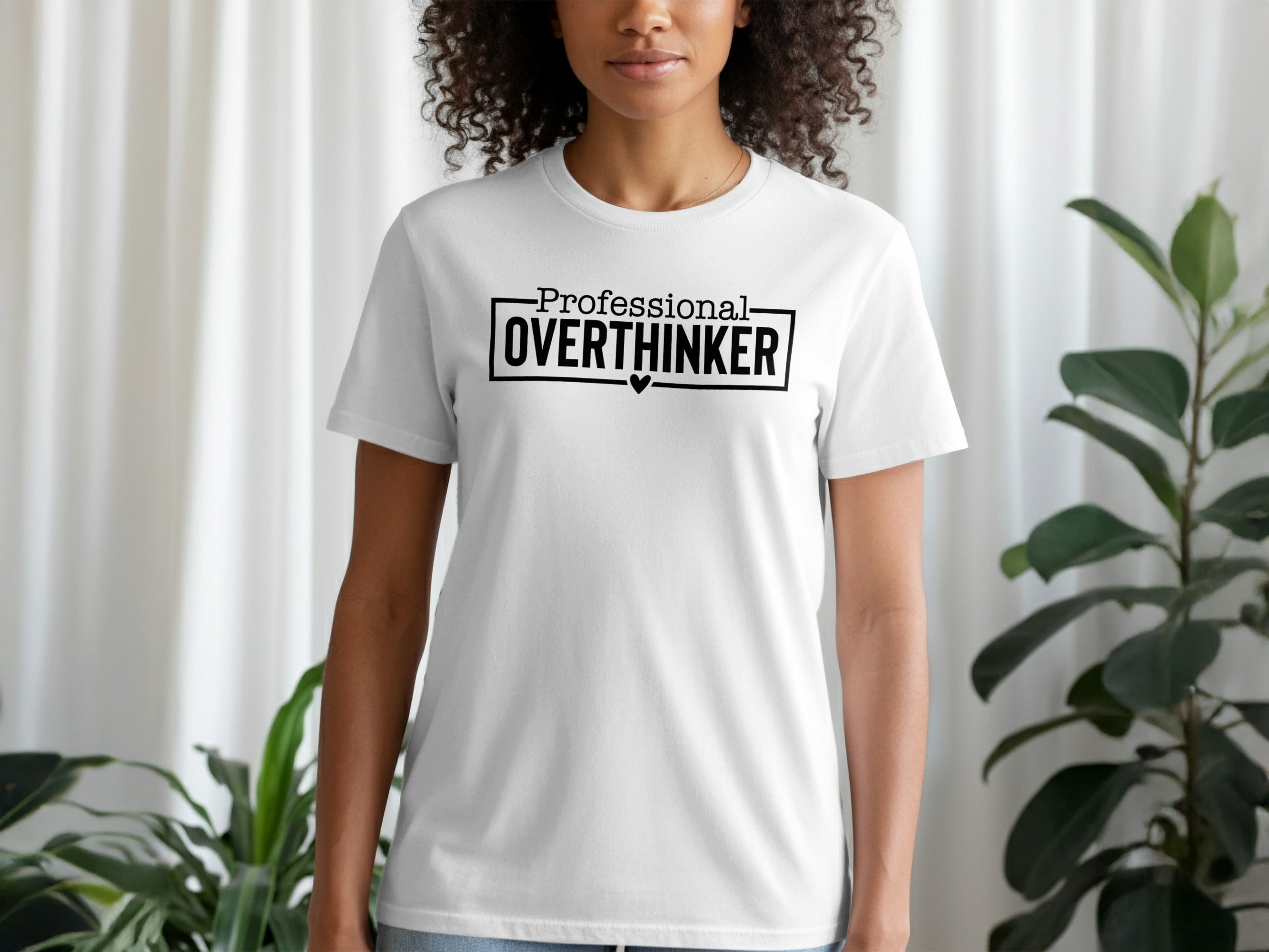 White t-shirt with black text "Professional OVERTHINKER" in a rectangle.
