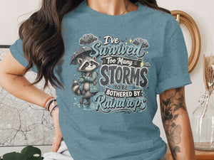 Raccoon with umbrella and text "I've survived too many storms to be bothered by raindrops".
