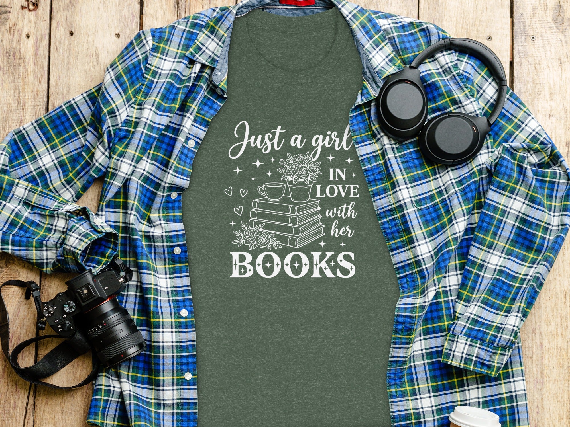 Green t-shirt with white text "Just a girl IN LOVE with her BOOKS" and illustrations.