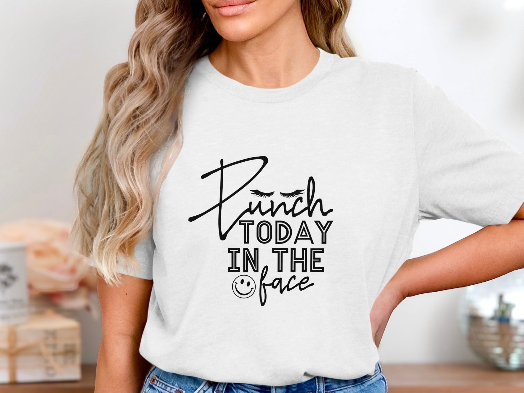White t-shirt with black text "Punch Today In The Face" and a smiley face.