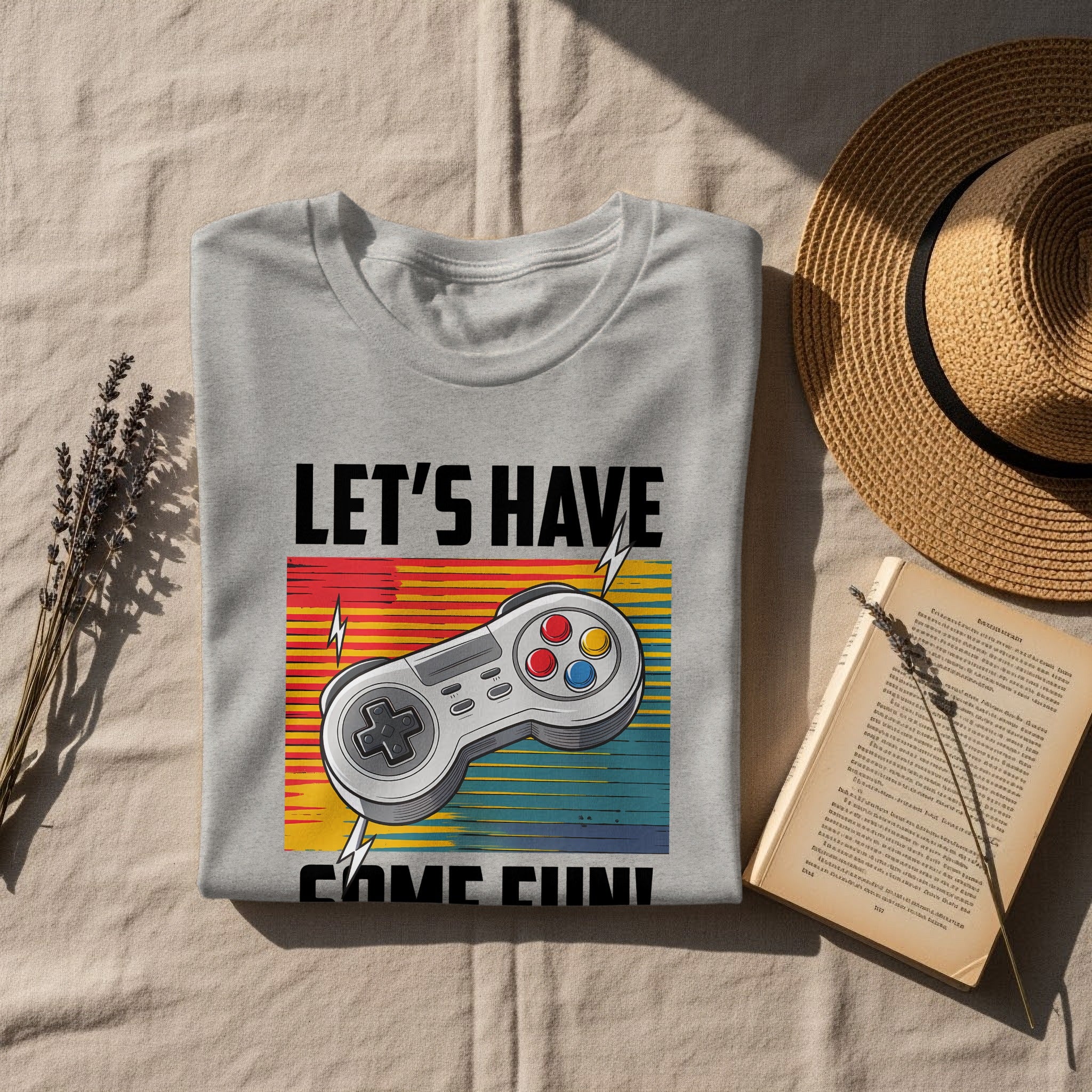 Grey t-shirt with "LET'S HAVE SOME FUN!" text and a retro video game controller.