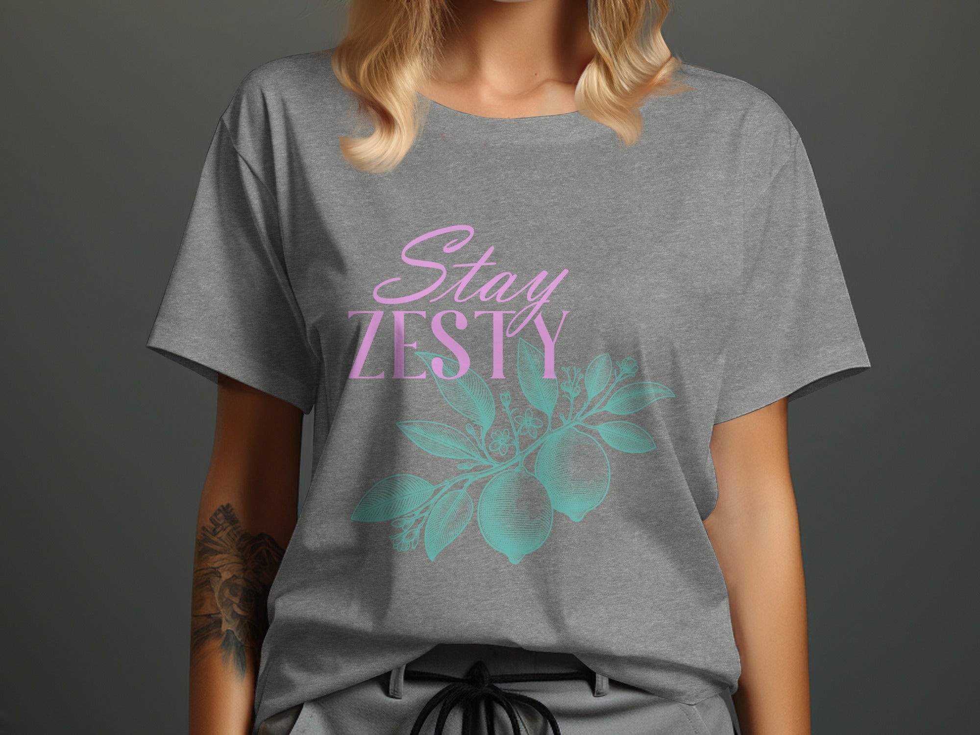 Grey t-shirt with "Stay ZESTY" text and lemon branch graphic.