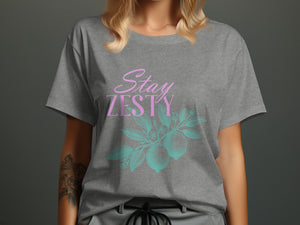 Grey t-shirt with "Stay ZESTY" text and lemon branch graphic.
