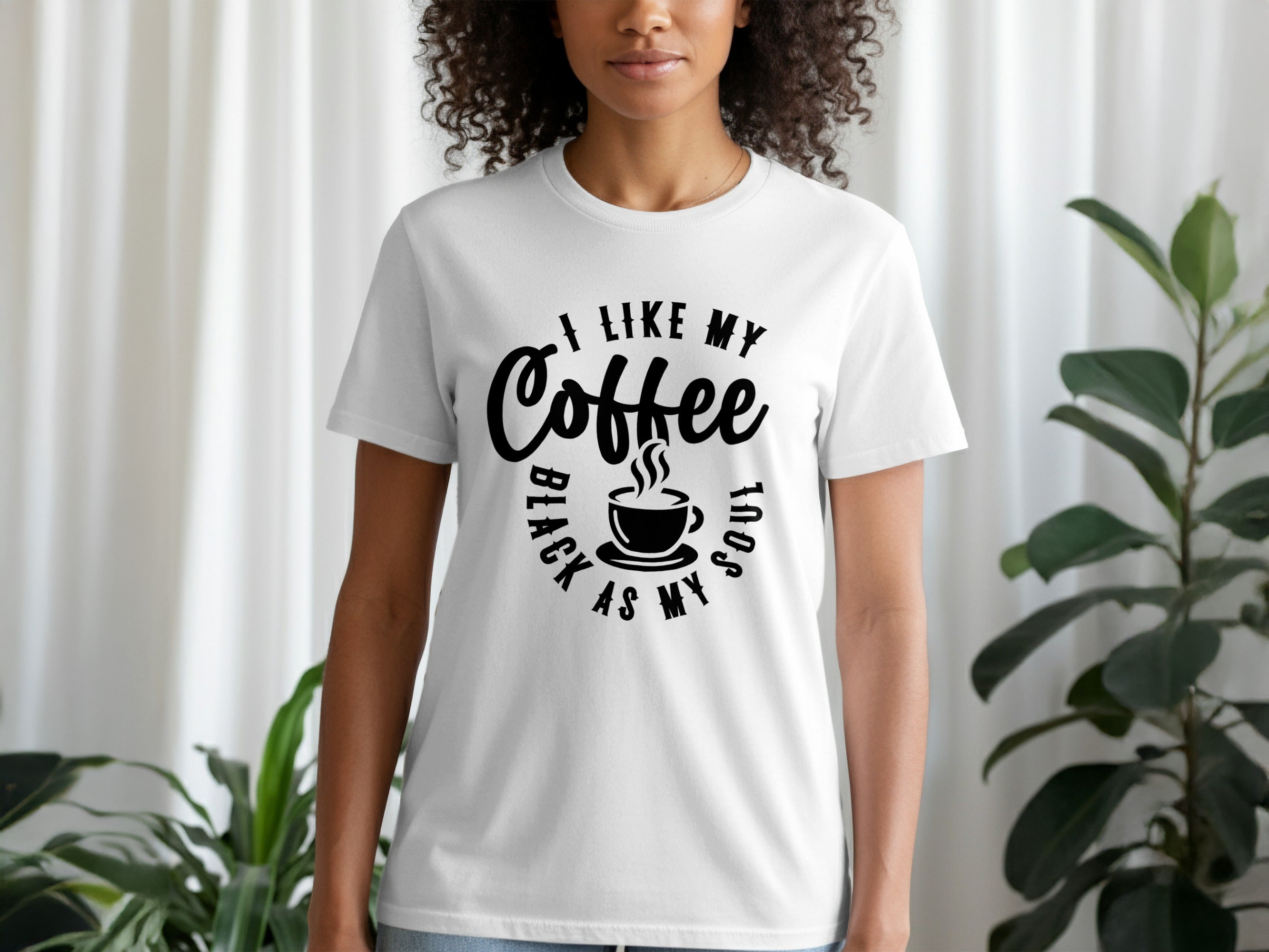 White t-shirt with black text and coffee cup graphic that reads "I like my coffee black as my soul".