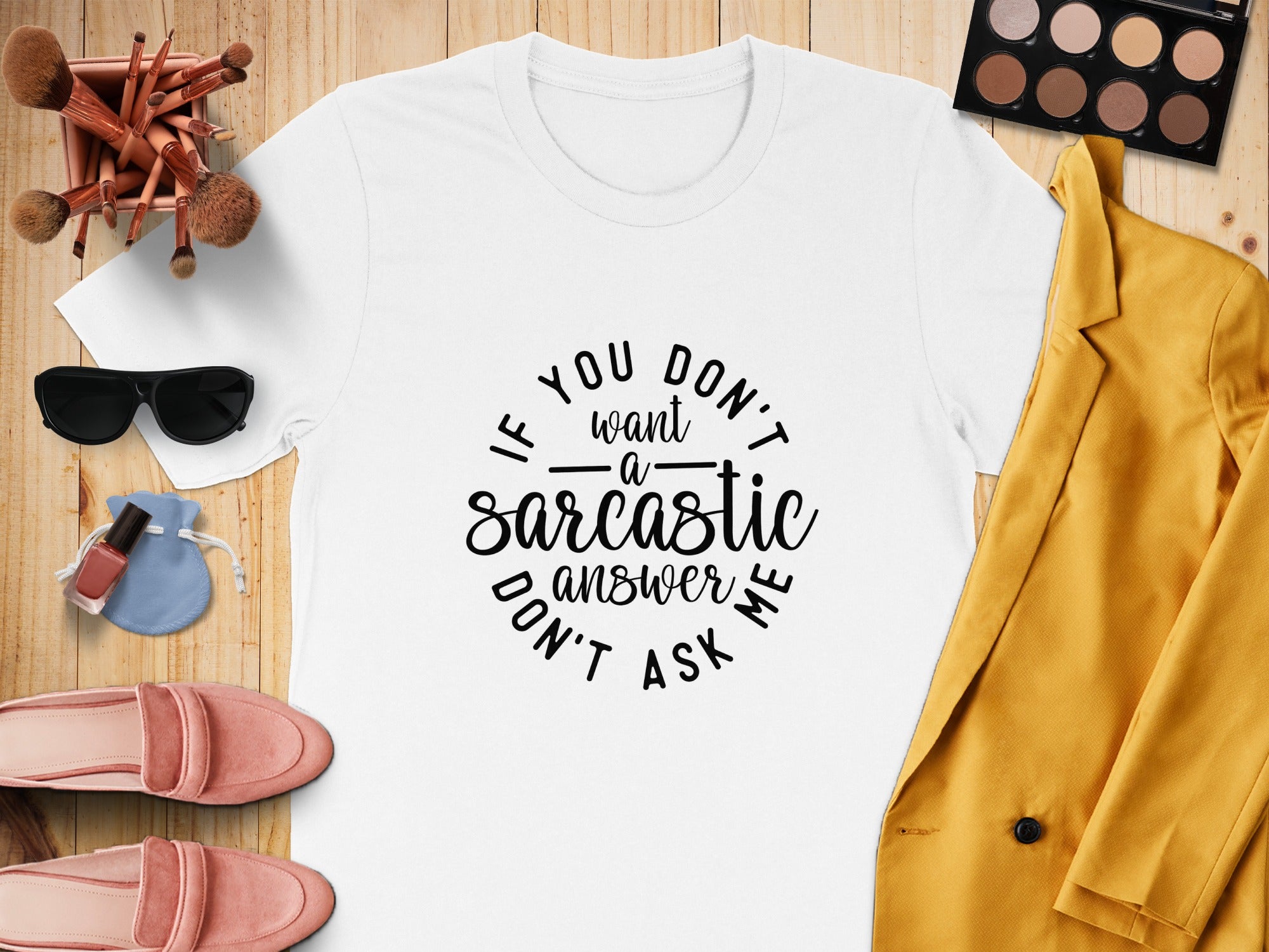 White t-shirt with "If you don't want a sarcastic answer don't ask me" text.