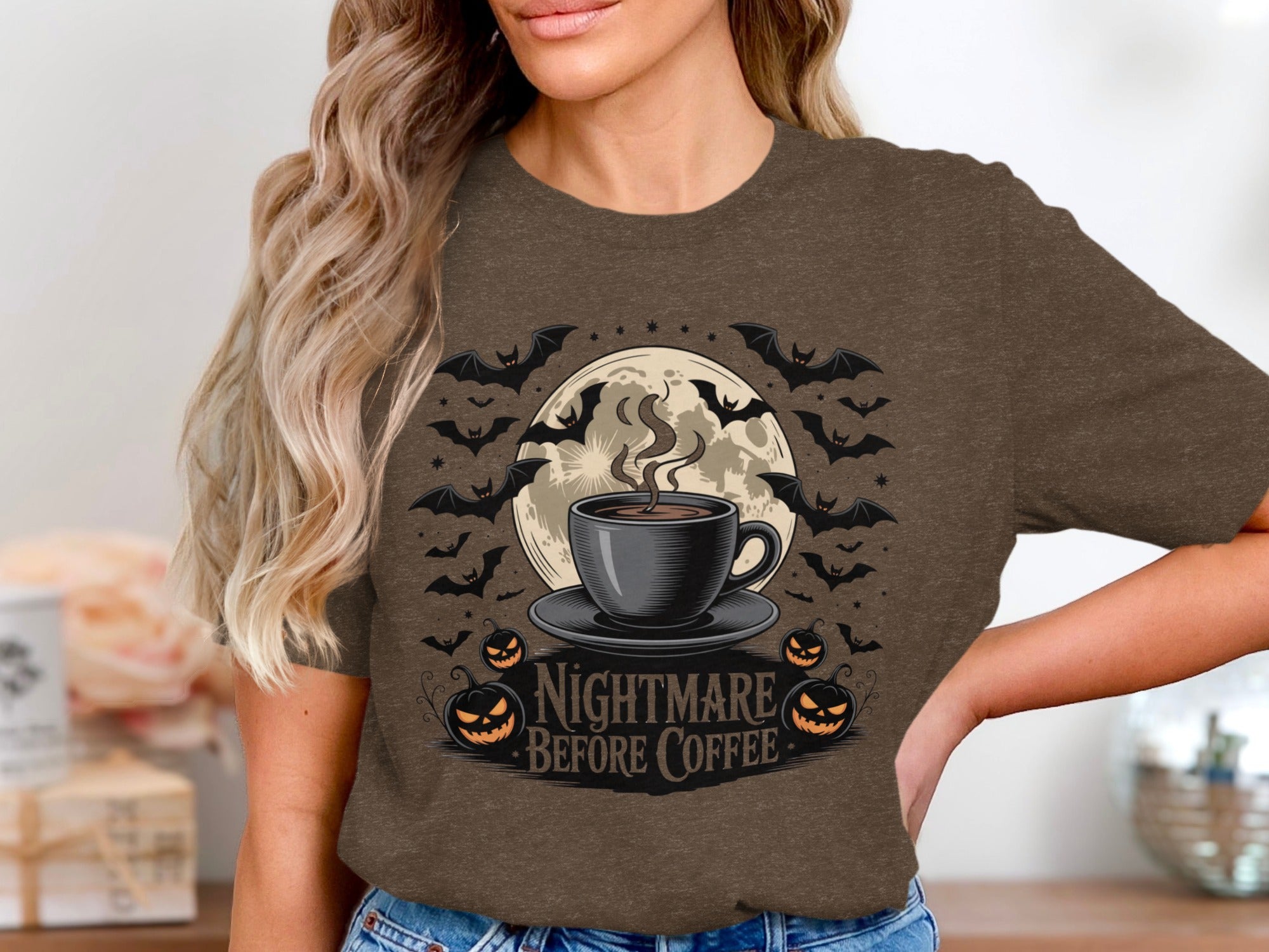 T-shirt with "Nightmare Before Coffee" text, coffee cup, pumpkins, bats, and moon.