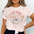 White t-shirt with "Cat Mom Social Club" graphic and paw print.