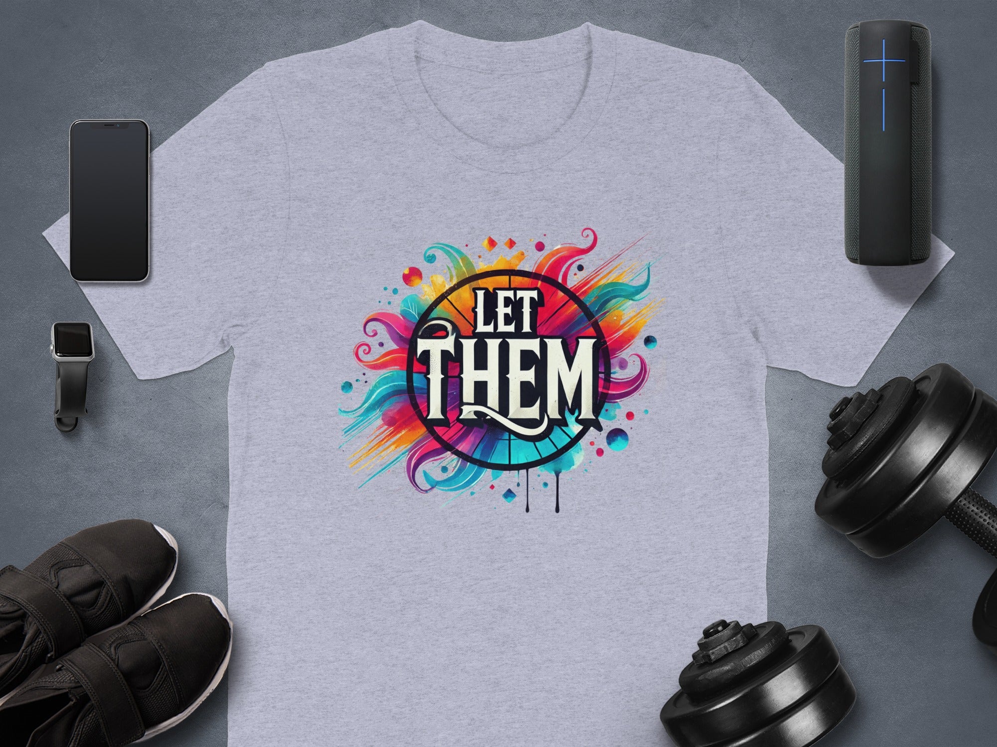 Light grey t-shirt with colorful "LET THEM" graphic and surrounding abstract elements.