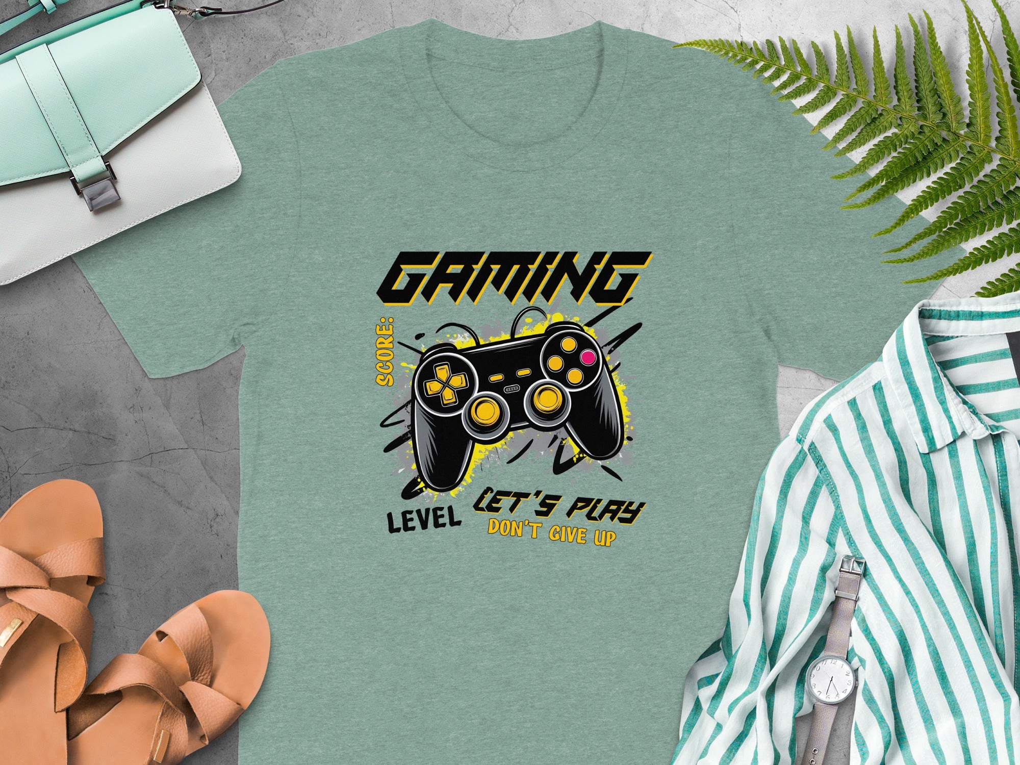 Green t-shirt with "GAMING" and a video game controller printing.