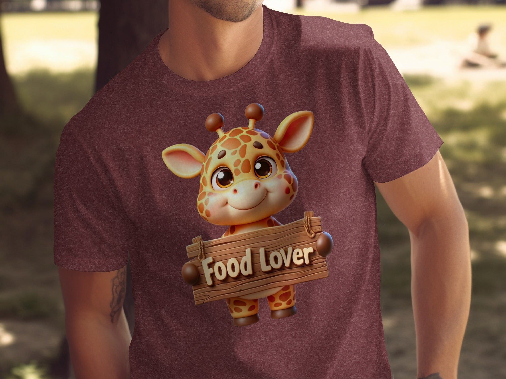 Maroon t-shirt with cartoon giraffe holding a wooden sign that reads "Food Lover".