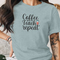 Light blue t-shirt with "Coffee Teach repeat" text and coffee cup graphic.