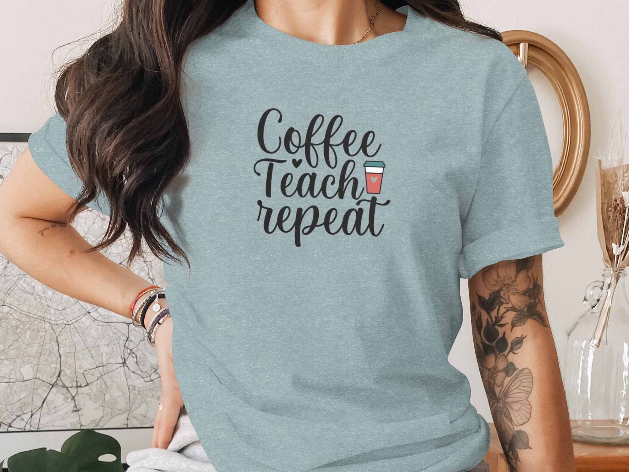 Light blue t-shirt with "Coffee Teach repeat" text and coffee cup graphic.