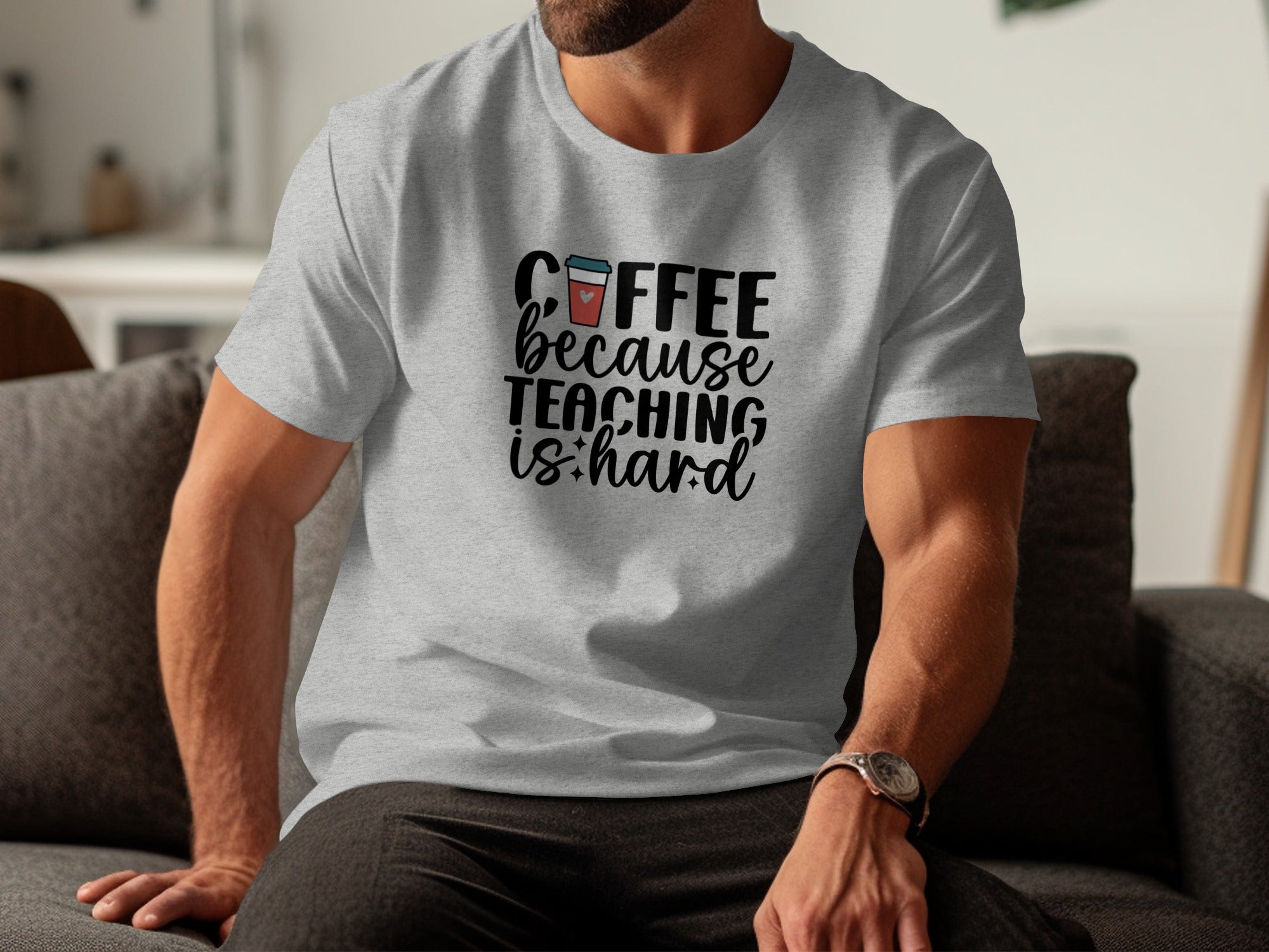 Grey t-shirt with "COFFEE because TEACHING is hard" graphic and coffee cup design.