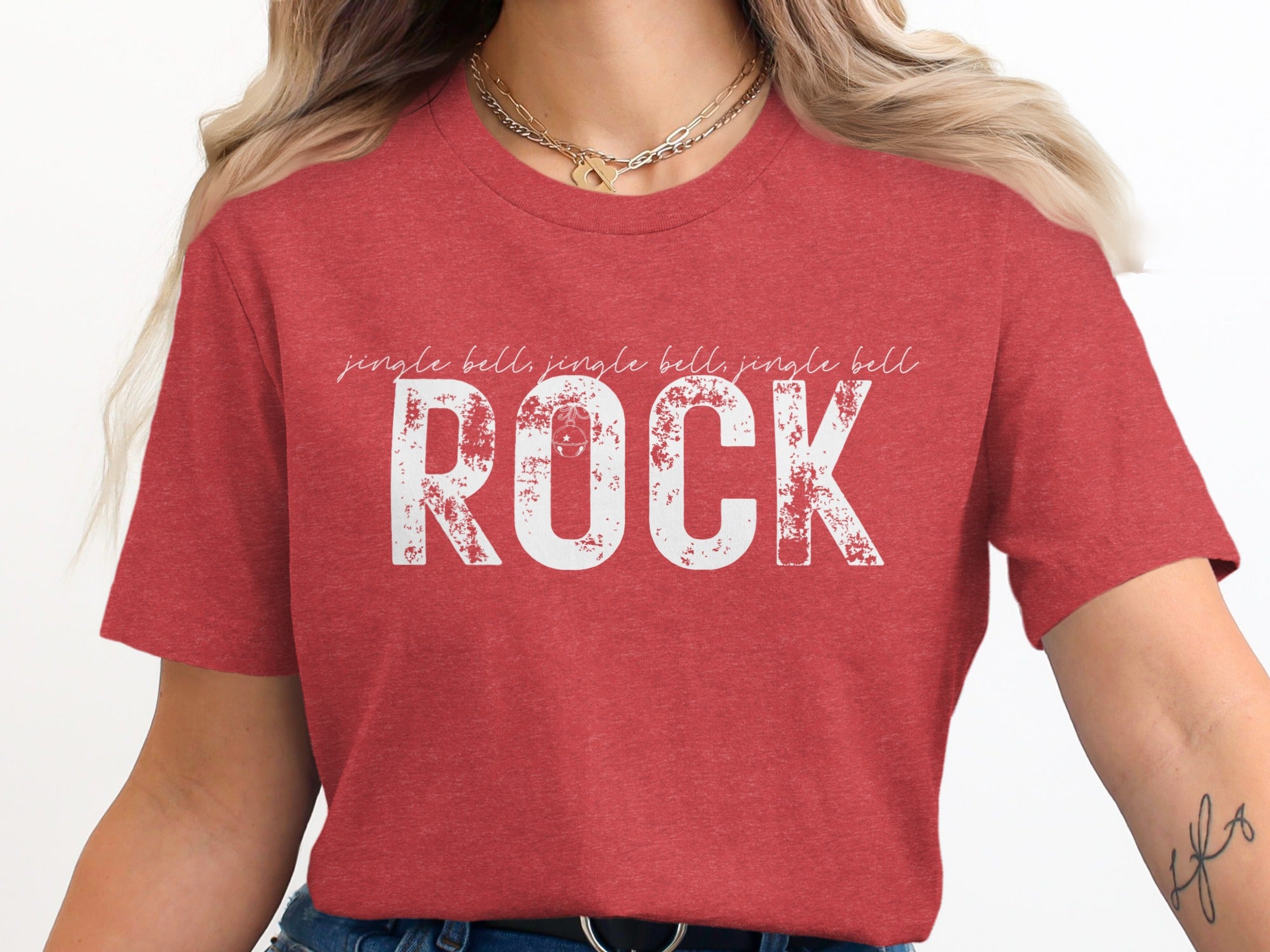 Red t-shirt with white distressed text "Jingle bells, jingle bells, jingle bell ROCK".