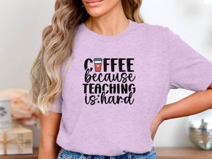 Lavender t-shirt with text "Coffee because teaching is hard" and coffee cup graphic.