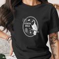 Black t-shirt with white Costa Rica toucan and hibiscus design in oval frame.