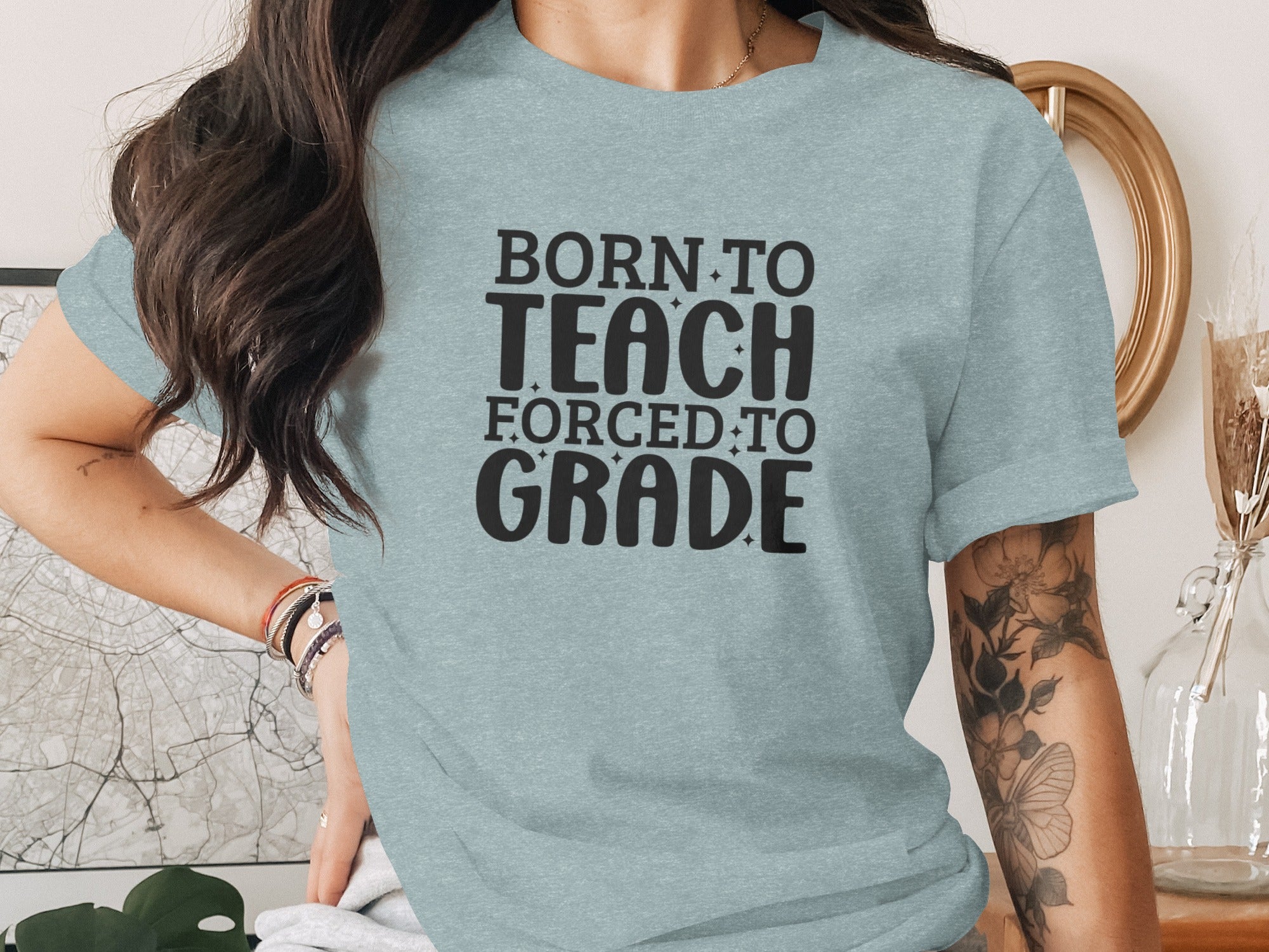 Light blue t-shirt with "BORN TO TEACH FORCED TO GRADE" text.