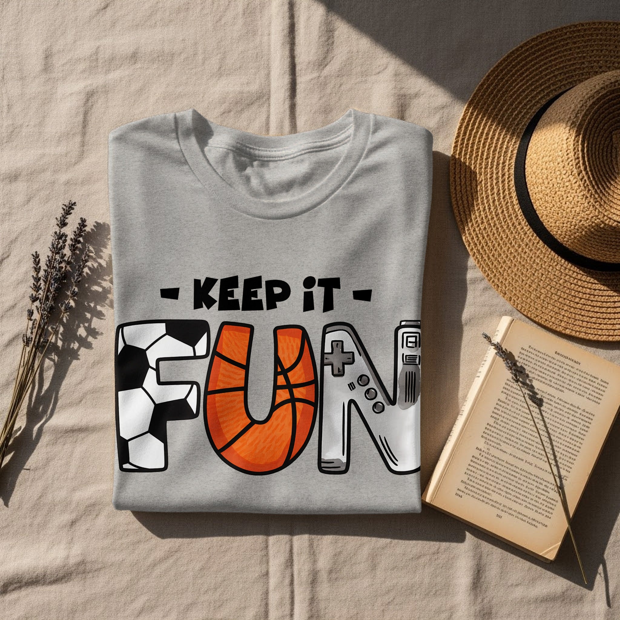 Grey t-shirt with "Keep It Fun" graphic featuring soccer ball, basketball, and game controller.