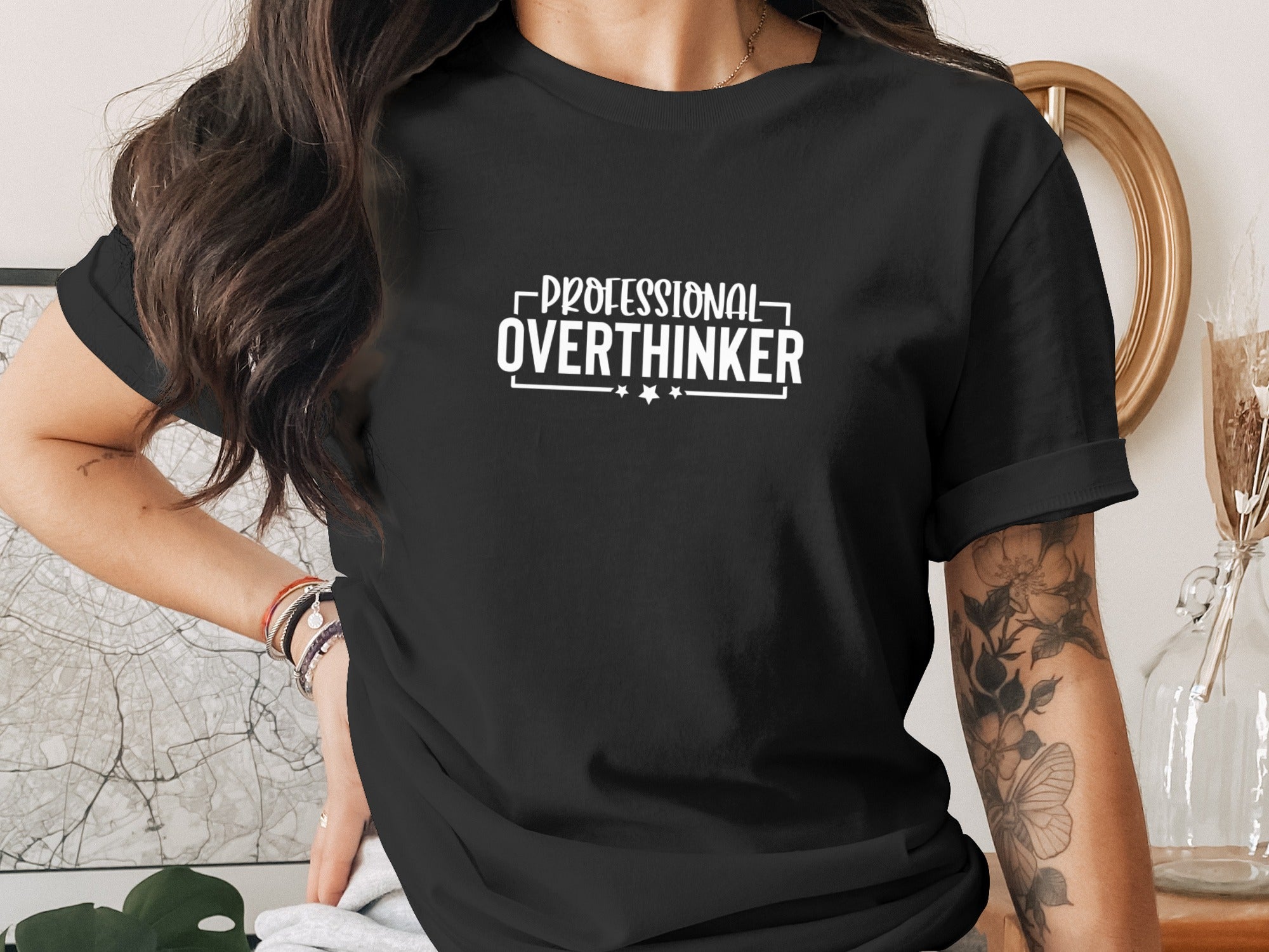 Black t-shirt with white text reading "PROFESSIONAL OVERTHINKER"