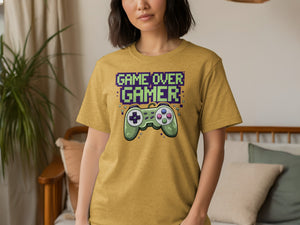 Yellow t-shirt with "GAME OVER GAMER" text and retro video game controller graphic.