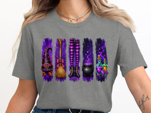 Halloween graphic on a gray t-shirt featuring a witch hat, broom, striped legs, cauldron, and potions.