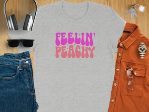 Grey t-shirt with pink "Feelin' Peachy" text and stars.