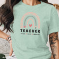 Mint green t-shirt with pastel rainbow graphic and "TEACHER" text.