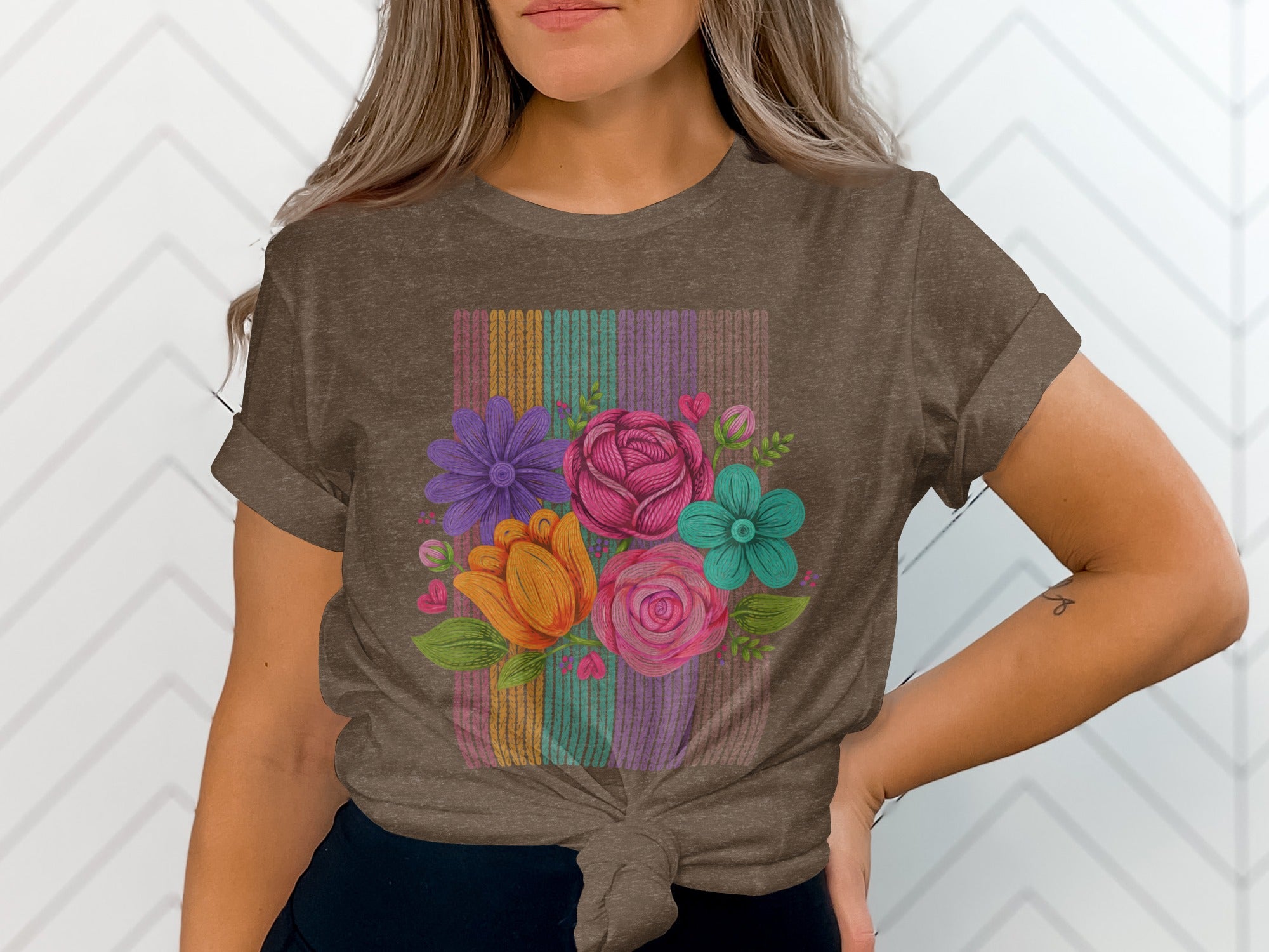 Brown t-shirt with a colorful floral bouquet design and striped background.