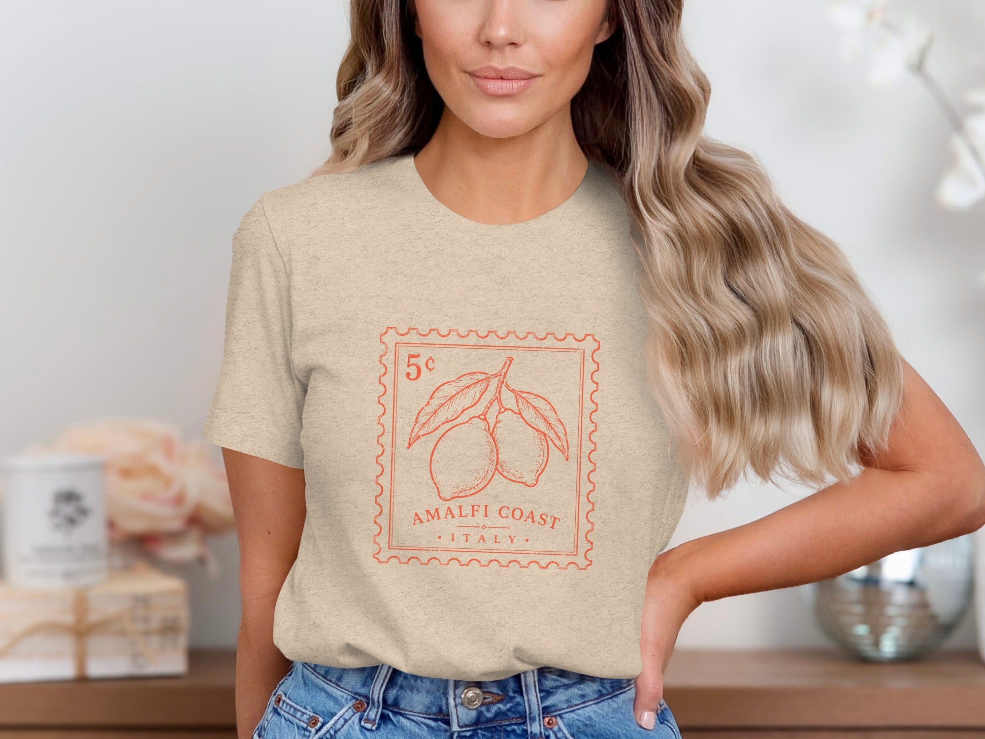 Beige t-shirt with a red stamp graphic featuring lemons and text.