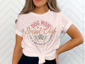 White t-shirt with "Dog Mom Social Club" and paw print graphic.