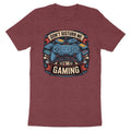Maroon t-shirt featuring a design with a game controller, game cartridges, and text.