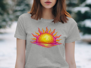 Grey t-shirt with a colorful sunset graphic and reflection.