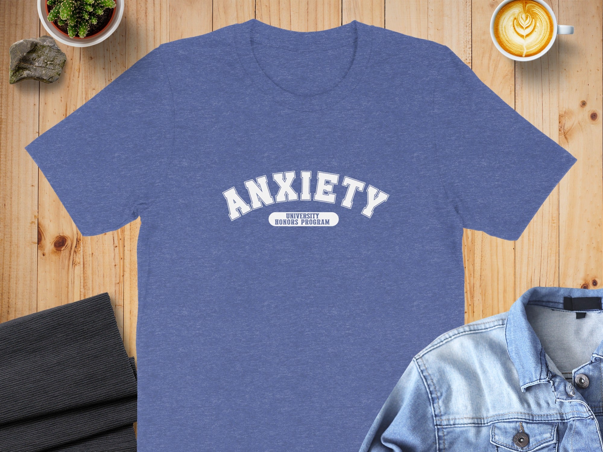 Blue t-shirt with "ANXIETY UNIVERSITY HONORS PROGRAM" text in white.
