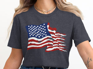 Distressed American flag graphic on a dark grey t-shirt.