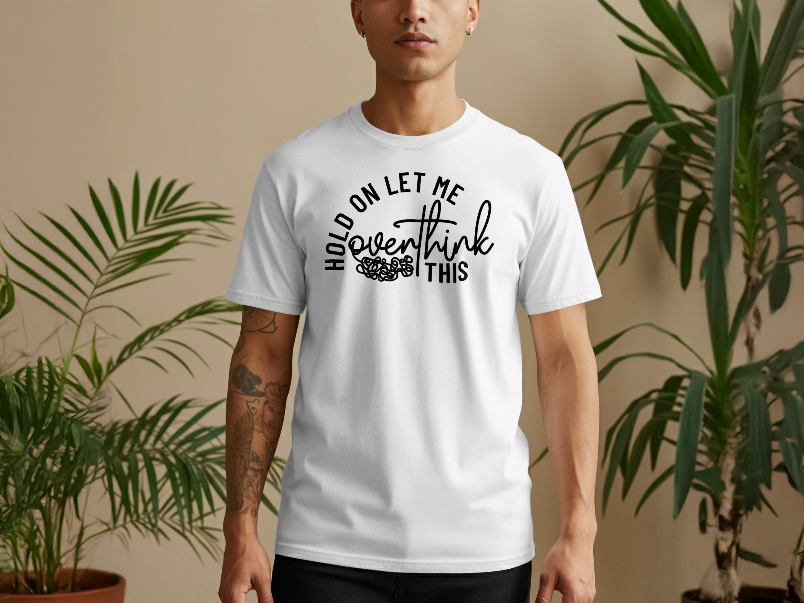 White t-shirt with black text: "Hold on let me overthink this."