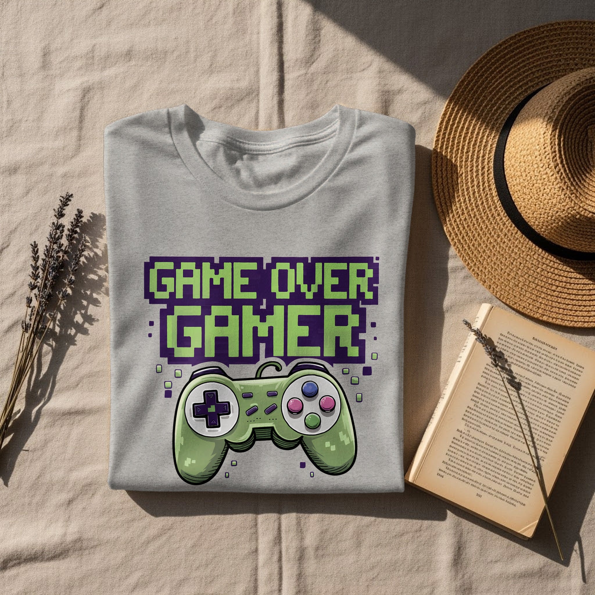 Grey t-shirt with pixelated "GAME OVER GAMER" text and a green controller.