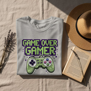 Grey t-shirt with pixelated "GAME OVER GAMER" text and a green controller.
