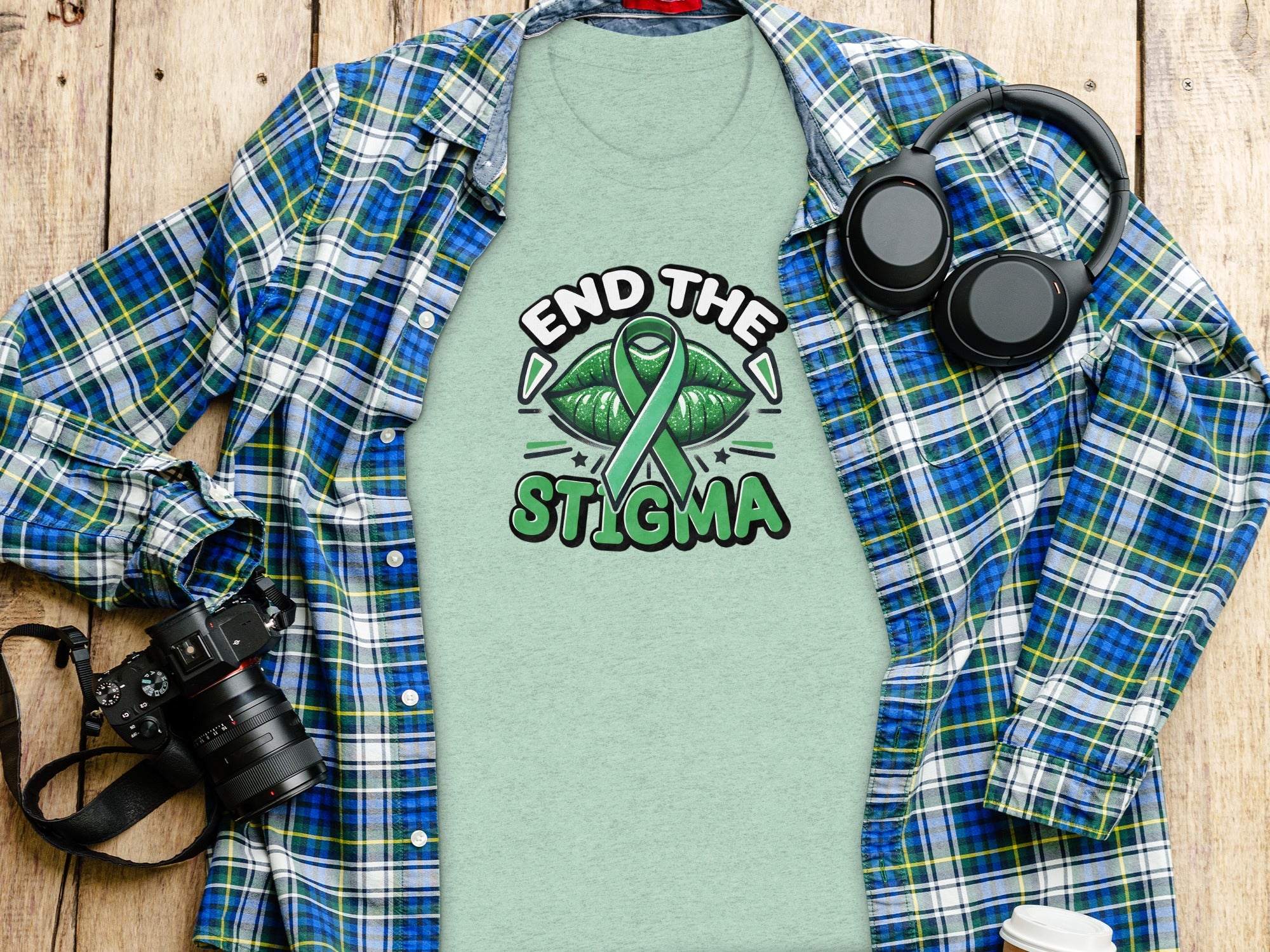 Light green t-shirt with green ribbon and text "END THE STIGMA".