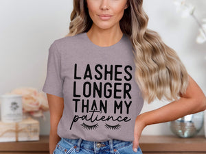 Gray t-shirt with black text: "Lashes Longer Than My Patience" and lash graphics.