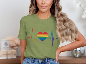 Green t-shirt with rainbow heart and heartbeat graphic.