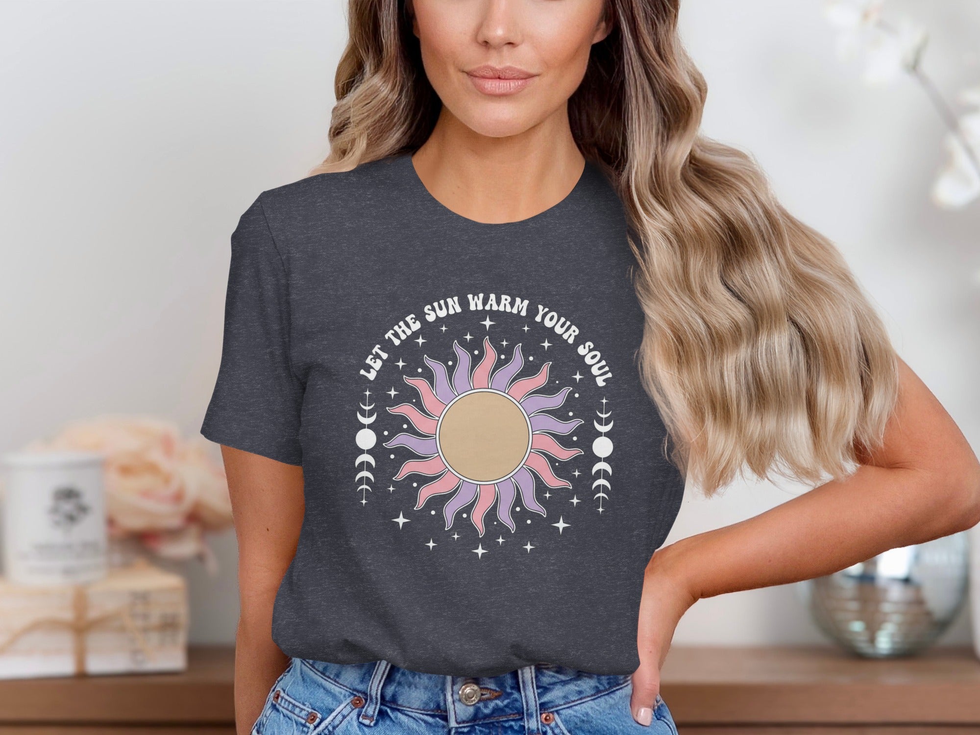 Dark gray t-shirt with sun graphic and text "LET THE SUN WARM YOUR SOUL".