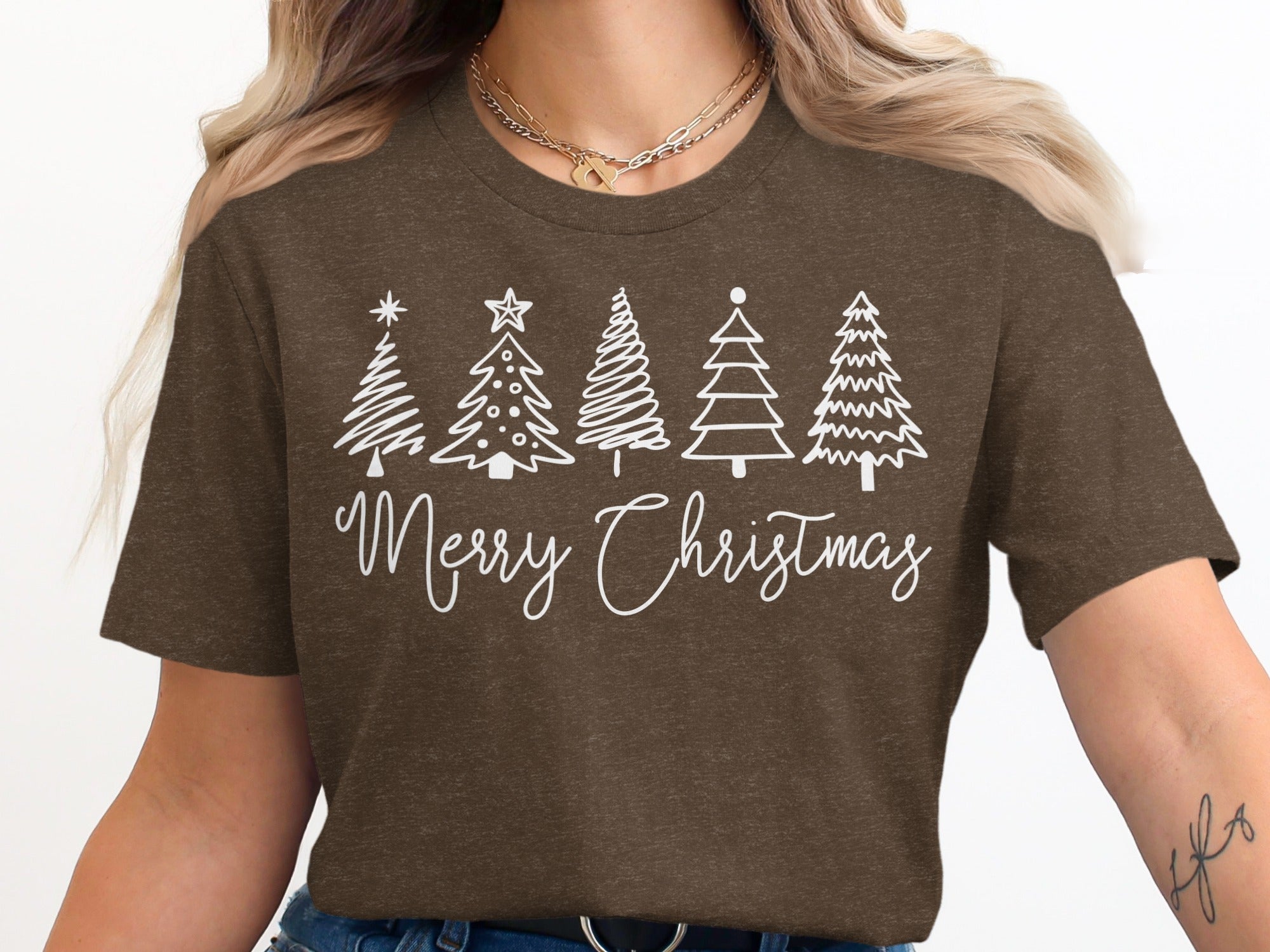 Brown t-shirt with white Christmas trees and "Merry Christmas" text.